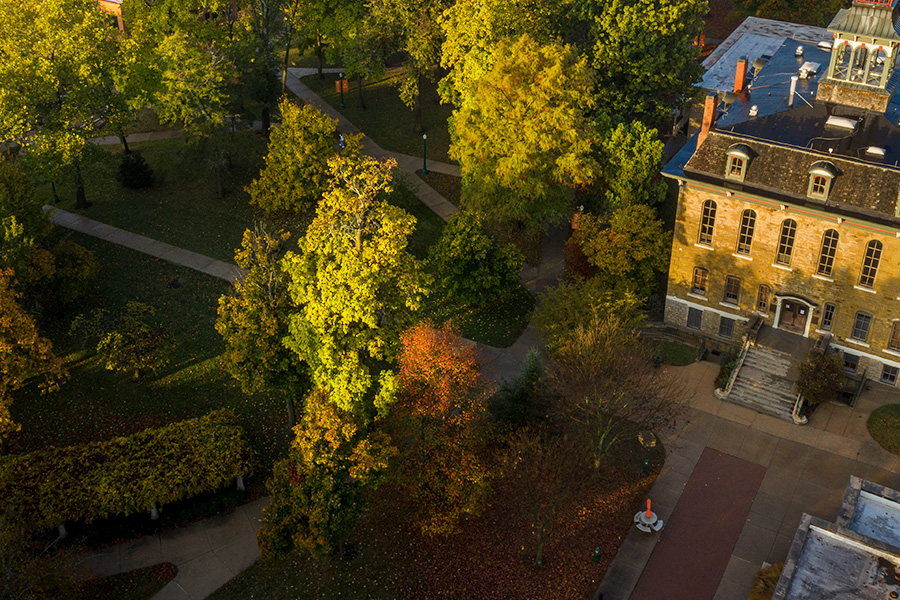 aerial view of parmenter hall and trees with beautiful fall colored trees