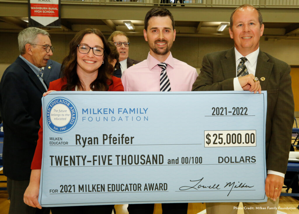 Ryan Pfeifer with his check and his mentor and another Milken Award winner