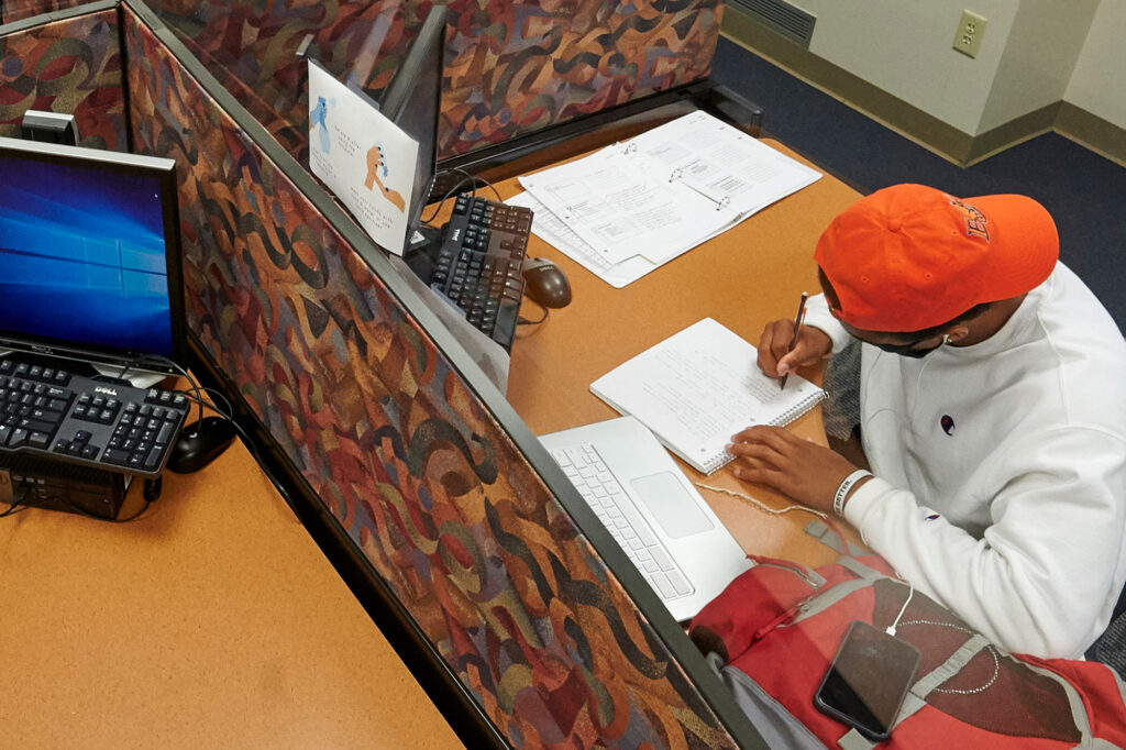 Student studying in Collins Library.