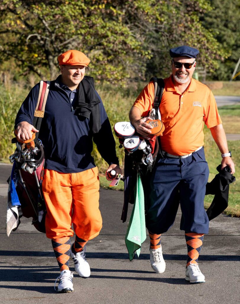 Two male golfers in old fashioned golf gear